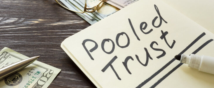 Pooled trust sign on the page and cash.