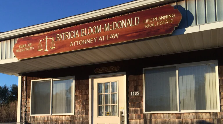 Exterior sign for Patricia Bloom-McDonald, Attorney at Law, above law office entrance